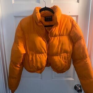 🌟 Bright Orange Puffer Jacket – Small, Warm & Fashion-Forward!